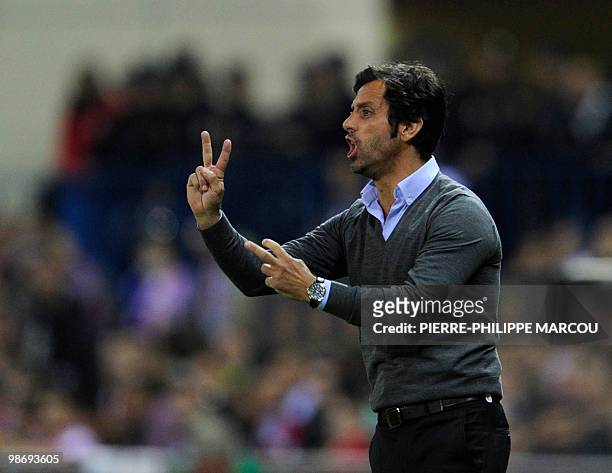 Atletico Madrid's coach Quique Sanchez Flores gestures during the UEFA Europa league semi-final first leg football match Atletico Madrid against...