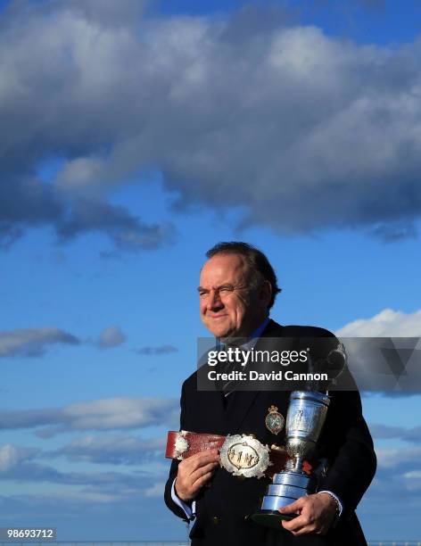 Peter Dawson the Chief Executive of the R&A holds the Open Championship Trophy and the original Champion Belt awarded to the early winners of the...