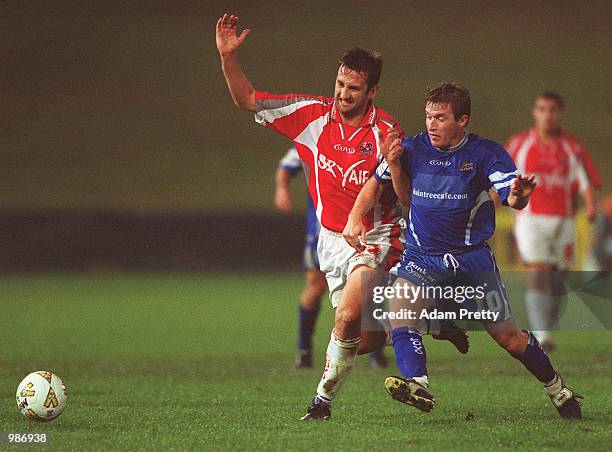 Troy Haplin of Sydney Olympic contests the ball with Steve Horvat of Melbourne Knights during the minor semi final at Parramatta Stadium. Sydney...