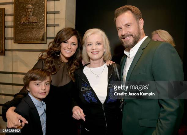 Karen Fairchild of Little Big Town, Norah Lee and Jimi Westbrook of Little Big Town take photos during the Country Music Hall of Fame and Museum's...