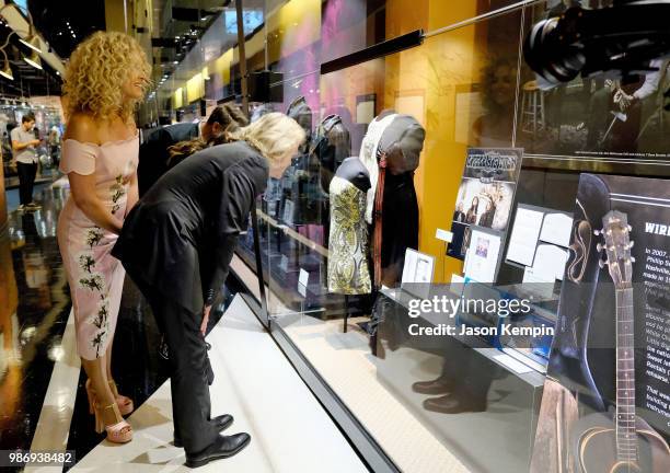 Kimberly Schlapman, Philip Sweet, Karen Fairchild and Jimi Westbrook of Little Big Town view their exhbit at The Country Music Hall of Fame and...