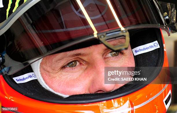 Mercedes driver Michael Schumacher of Germany waits in his car to leave during the third practice session for Formula One's Malaysian Grand Prix in...