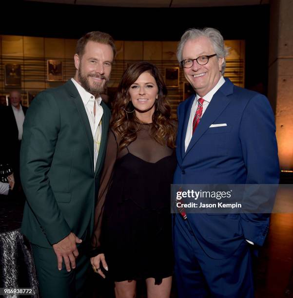 Jimi Westbrook and Karen Fairchild of Little Big Town and Director and CEO of the Country Music Hall of Fame and Museum Kyle Young take photos during...