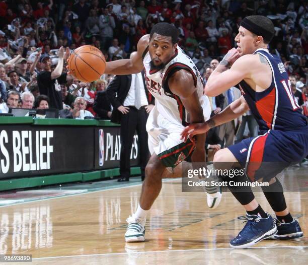 John Salmons of the Milwaukee Bucks drives against Mike Bibby of the Atlanta Hawks in Game Four of the Eastern Conference Quarterfinals during the...