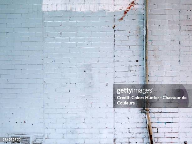 white bricks and electric cable montreal - white warehouse stock pictures, royalty-free photos & images