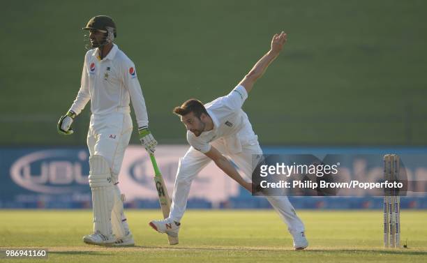 Mark Wood of England bowls past Shoaib Malik of Pakistan during the 1st Test match between Pakistan and England at the Sheikh Zayed Stadium, Abu...