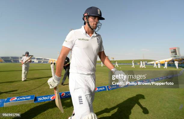 England captain Alastair Cook leaves the field on 237 not out for the tea interval on day four of the 1st Test match between Pakistan and England at...