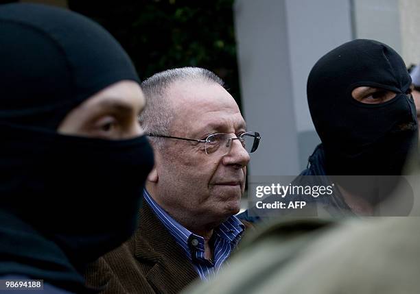 Giovanni Tegano a top mafia boss who was among the country's 30 most dangerous fugitives, is escorted from police headquarters after his arrest in...