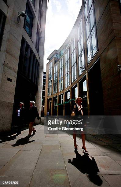 Pedestrians pass the Goldman Sachs offices, right, at Newgate Street in London, U.K., on Monday, April 26, 2010. Goldman Sachs Group Inc., Wall...