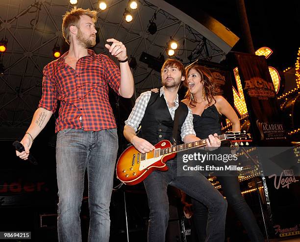 Charles Kelley, Dave Haywood and Hillary Scott of the band Lady Antebellum perform during the Academy of Country Music all-star concert at the...