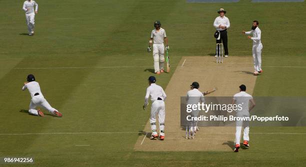 Jonny Bairstow of England catches Pakistan's opening batsman Mohammad Hafeez for 19 runs off the bowling of Moeen Ali during the 2nd Test match...