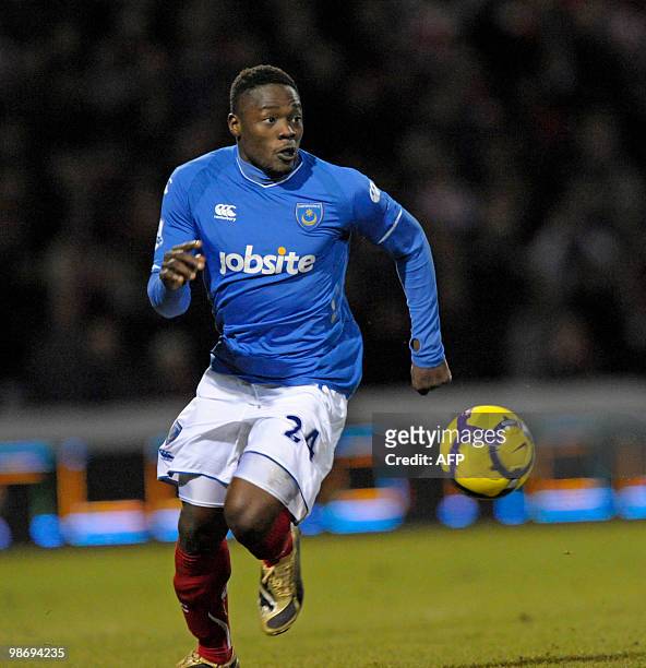 Portsmouth's Ivorian striker Aruna Dindane in action during the English Premier League football match between Portsmouth and Stoke City at Fratton...