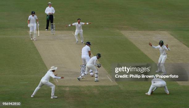 England captain Alastair Cook is caught by substitute fielder Ahmed Shehzad of Pakistan off the bowling of Yasir Shah for 65 runs during the 2nd Test...