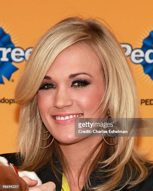 Country singer/songwriter Carrie Underwood attends the 6th Annual Pedigree Adoption Drive at Bidawee Manhattan Shelter on March 30, 2010 in New York...
