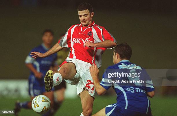 Paul Kohler of Sydney Olympic contests the ball with Ivan Jolic of Melbourne Knights during the minor semi final at Parramatta Stadium. Sydney...