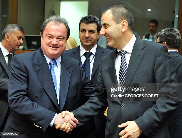 Romanian Minister of Administration and Interior Vasile Blaga shakes hand with Bulgarian Interior Minister Tsvetan Tsvetanov prior to the Justice and...