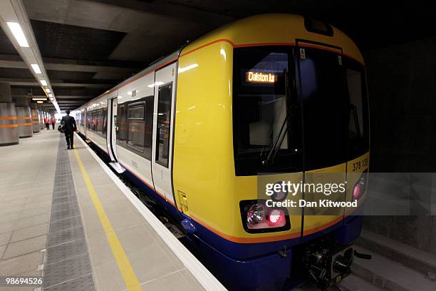 The first train waits to leave the platform at Dalston Junction which forms part of the new East London overground rail link at Dalston Junction on...