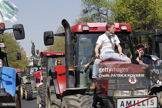French farmers drive their tractors near the place de la Republique in Paris on April 27, 2010 as they demonstrate against wages cut and to denounce...