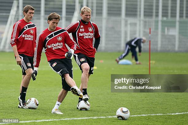 Stefan Reinartz, Rene Adler and Lukas Sinkiewicz attend the training session of Bayer Leverkusen at the training ground on April 27, 2010 in...