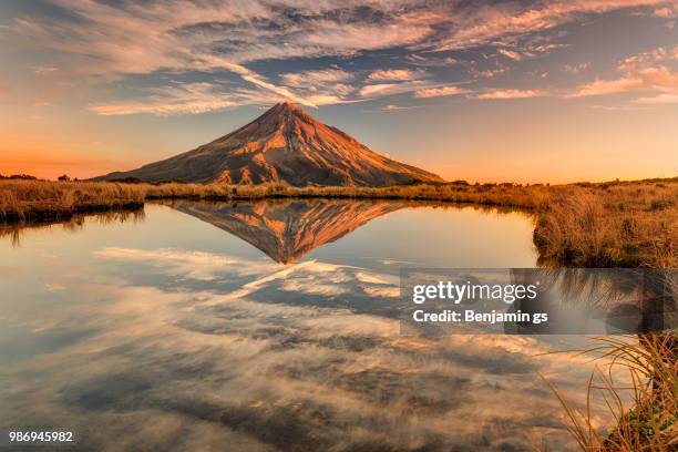 sunset on taranaki - dormant volcano stock pictures, royalty-free photos & images