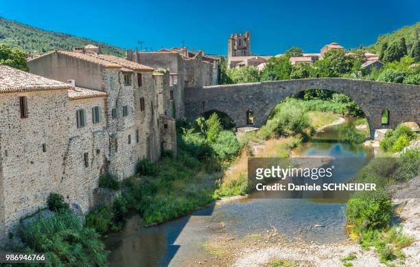 france, aude, lagrasse, bridge on the orbieu river (labelled "most beautiful village in france") - circa 7th century stock pictures, royalty-free photos & images