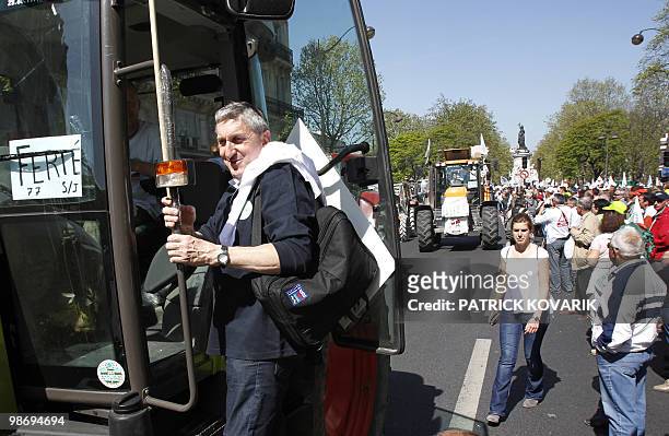 President of the main farmers' union - National Farmers union - Jean-Michel Lemetayer climbs onto a tractor next to the place de la Republique in...