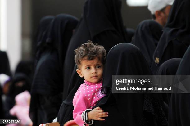 People who have been displaced from Sea Port city of Hodeidah visit a displacement registration centre to register their names on June 27, 2018 in...