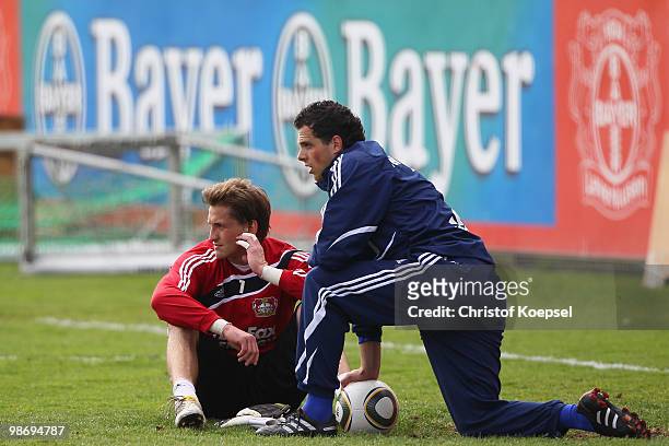 Rene Adler and Benedikt Fernandez look on during the training session of Bayer Leverkusen at the training ground on April 27, 2010 in Leverkusen,...