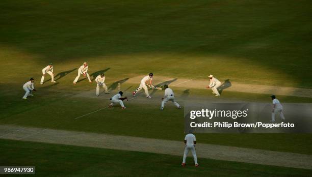 England's number 11 batsman James Anderson is surrounded by fielders as Pakistan press for the final wicket during the 2nd Test match between...