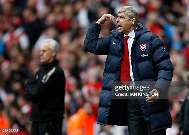 Arsenal's French manager Arsene Wenger gestures during the English Premier League football match between Arsenal and Wolverhampton Wanderers at The...