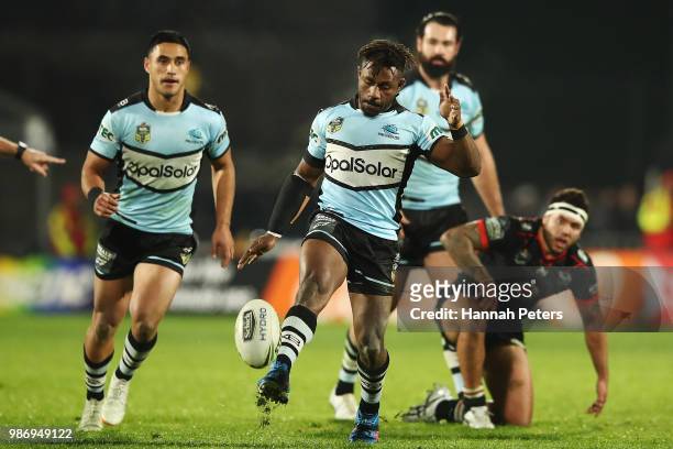 James Segeyaro of the Sharks kicks the ball through during the round 16 NRL match between the New Zealand Warriors and the Cronulla Sharks at Mt...