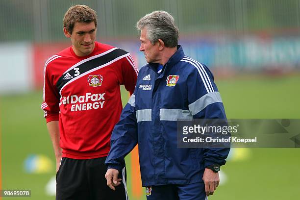 Stefan Reinartz and head coach Jupp Heynckes talk during the training session of Bayer Leverkusen at the training ground on April 27, 2010 in...