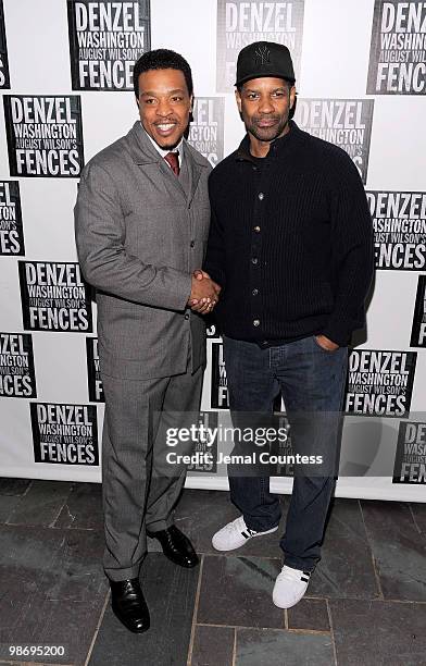 Actors Russell Hornsby and Denzel Washington pose for photos at the Broadway Opening Night After Party for "Fences" at the Bryant Park Hotel on April...