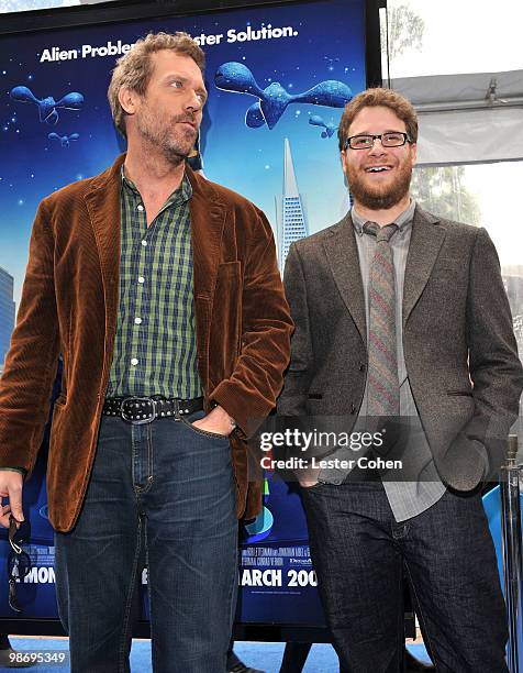 Actors Hugh Laurie and Seth Rogen arrive at the premiere of "Monsters vs. Aliens" held at the Gibson Amphitheatre on March 22, 2009 in Universal...