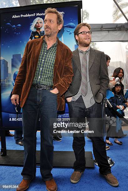 Actors Hugh Laurie and Seth Rogen arrive at the premiere of "Monsters vs. Aliens" held at the Gibson Amphitheatre on March 22, 2009 in Universal...