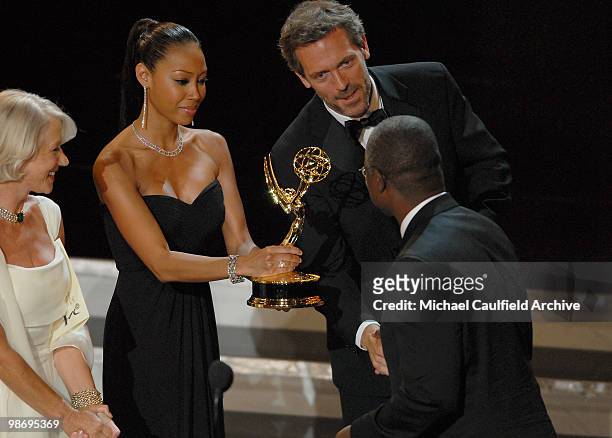 Andre Braugher, winner Outstanding Lead Actor in a Miniseries or Movie for �Thief�, with presenters Helen Mirren and Hugh Laurie