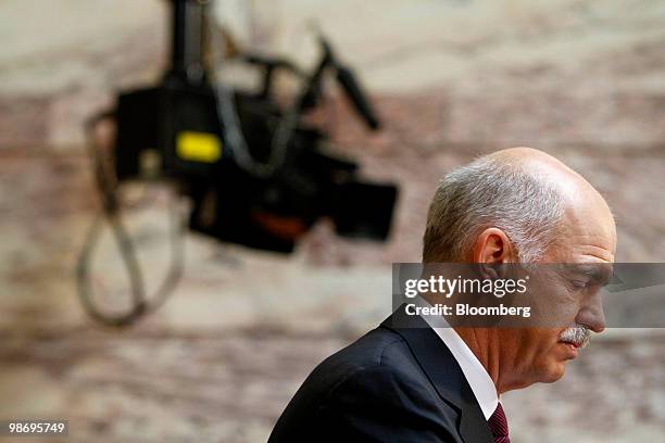 George Papandreou, Greece's prime minister, pauses during a speech to members of the Greek parliament at the Senate Hall in Athens, Greece, on...