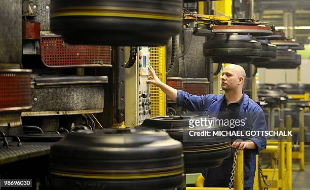 An employee works at the Goodyear Dunlop Tires Germany GmbH plant in the eastern German city of Fuerstenwalde on April 15, 2010. The plant produced...