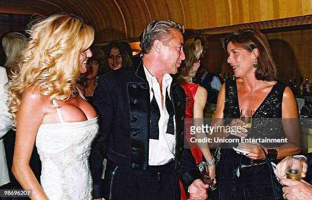 Michael Flatley's fiancé Lisa Murphy looks on as Princess Caroline congratulates Michael Flatley on being presented with her Family's Grimaldi medal...