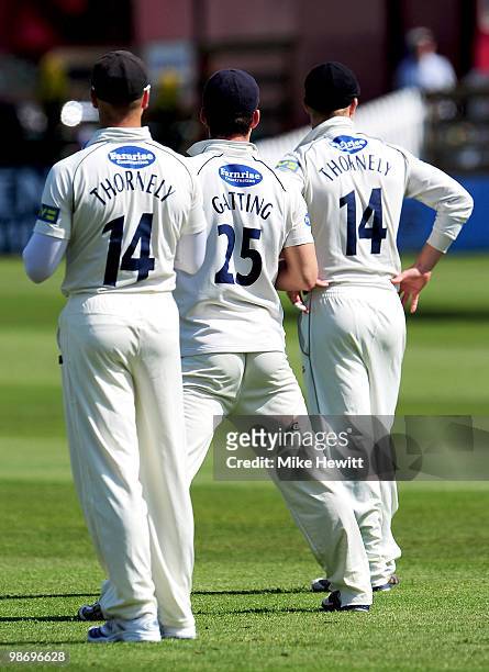 Joe Gatting of Sussex appears to field between two Michael Thornelys during the LV County Championship match between Sussex and Leicestershire at the...