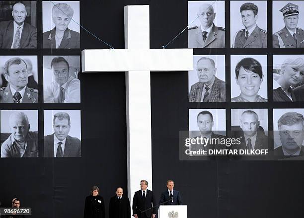 Polish Prime Minister Donald Tusk delivers a speech on April 17, 2010 next to Izabela Sariusz-Skapska, daughter of the head of Federation of Katyn...
