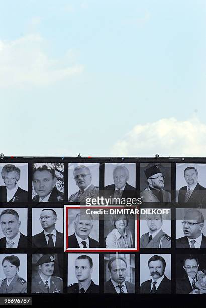 Photo taken on April 17, 2010 shows photos of late Polish President Lech Kaczynski , his wife Maria surrounded by other victims of the Polish...