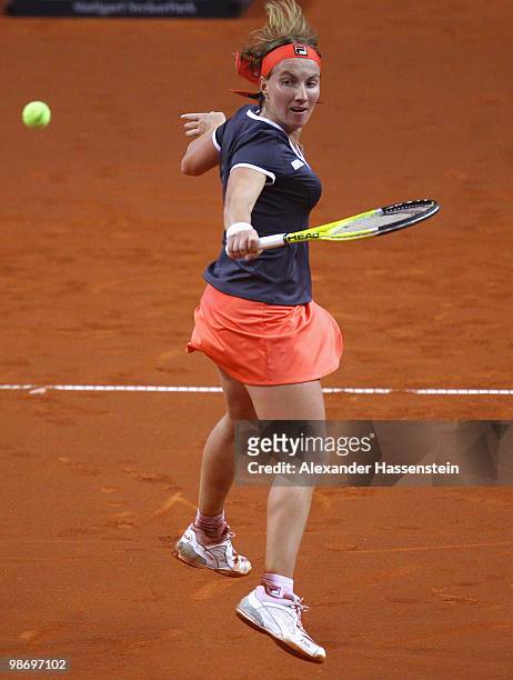 Svetlana Kuznetsova of Russia plays a backhand during her first round match against Katarina Sreboznik of Slovenia at day tow of the WTA Porsche...