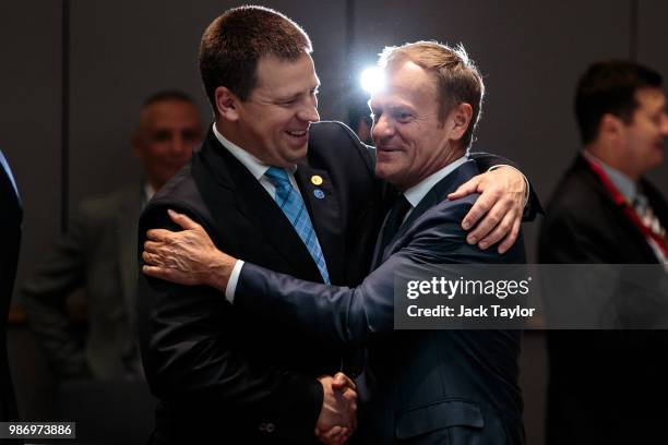 Prime Minister of Estonia Juri Rata greets President of the European Council Donald Tusk ahead of roundtable discussions on the final day of the...