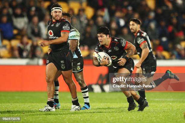 Issac Luke of the Warriors makes a break during the round 16 NRL match between the New Zealand Warriors and the Cronulla Sharks at Mt Smart Stadium...