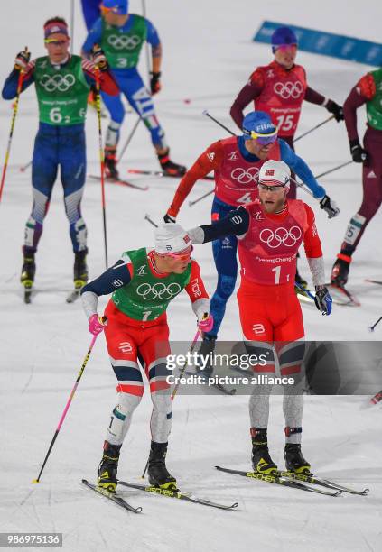 Martin Johnsrud Sundby being relievd by Johannes Hoesflot Klaebo from Norway during the men's free team sprint nordic skiing event of the 2018...