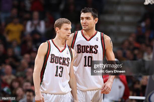 Luke Ridnour and Carlos Delfino of the Milwaukee Bucks walk down the court during the game against the Atlanta Hawks on April 12, 2010 at the Bradley...