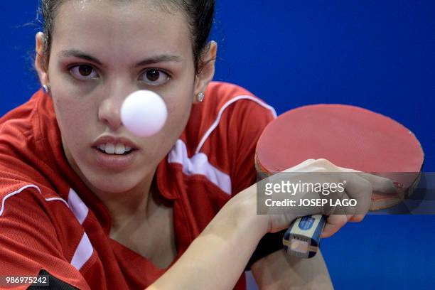 Egyptian Dina Meshref competes during the women's table tennis group C match 3 at the XVIII Mediterranean Games in Valls, near Tarragona on June 29,...