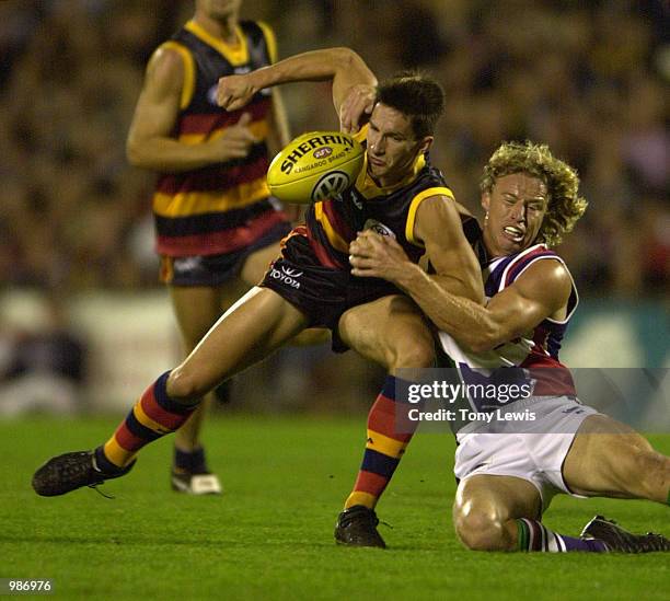 Hayden Skipworth for Adelaide is tackled by Shaun McManus for Fremantle in the match between the Adelaide Crows and the Fremantle Dockers in round 7...