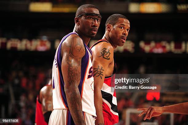 Amare Stoudemire of the Phoenix Suns and Marcus Camby of the Portland Trail Blazers stand on the court in Game One of the Western Conference...